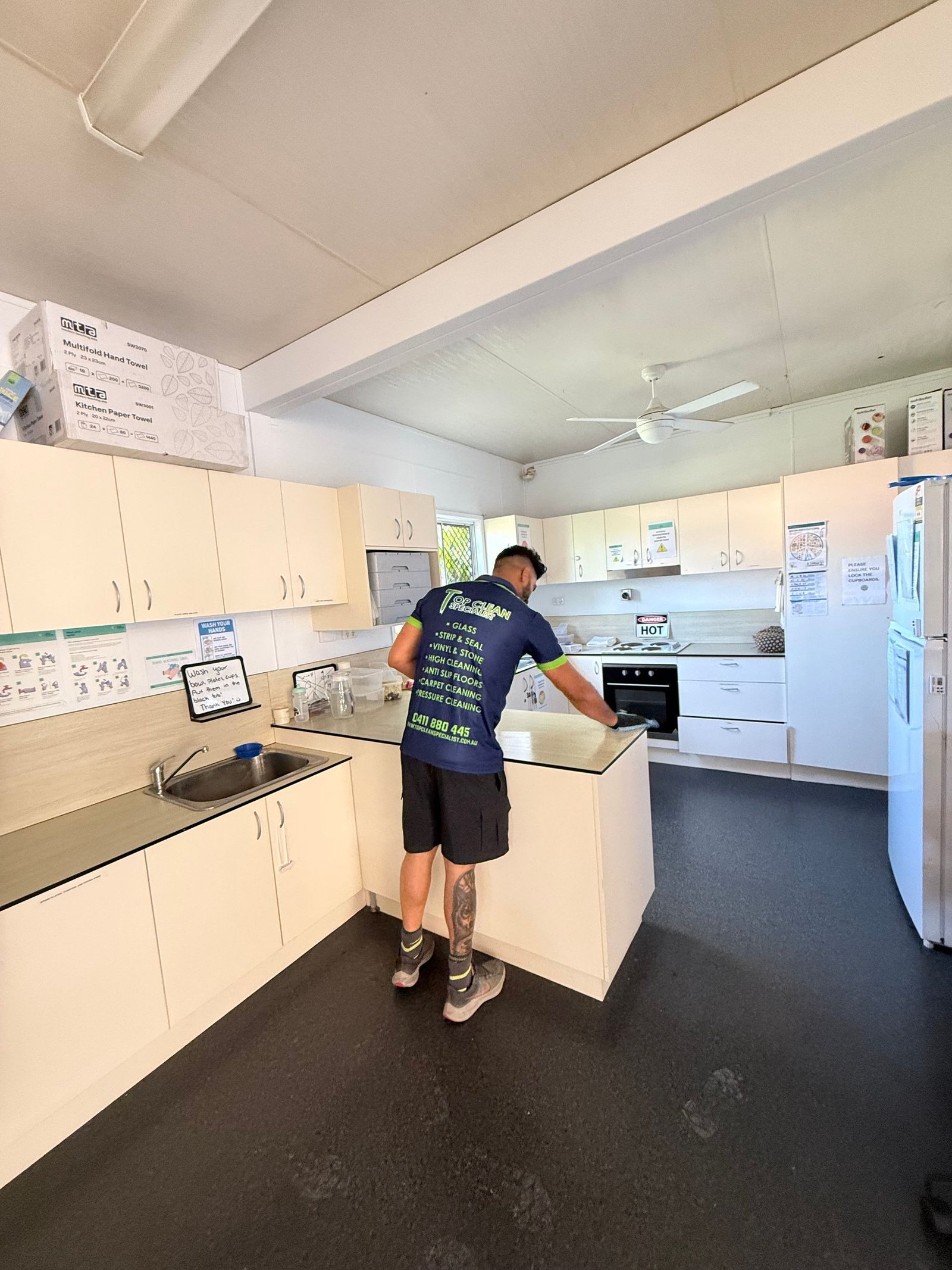 Top Clean Specialist technician cleaning a kitchen in Queensland